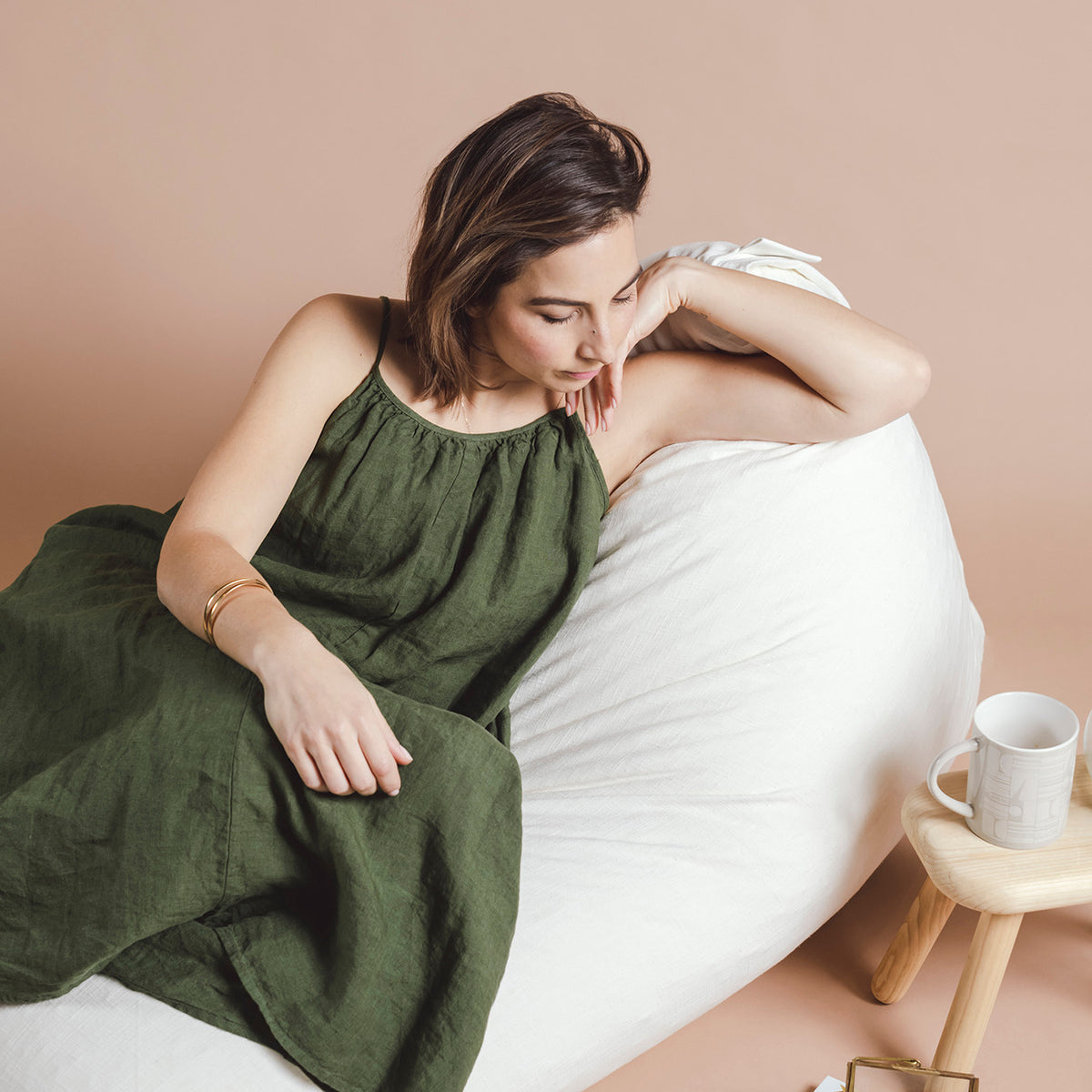 Woman relaxing on a white bean bag