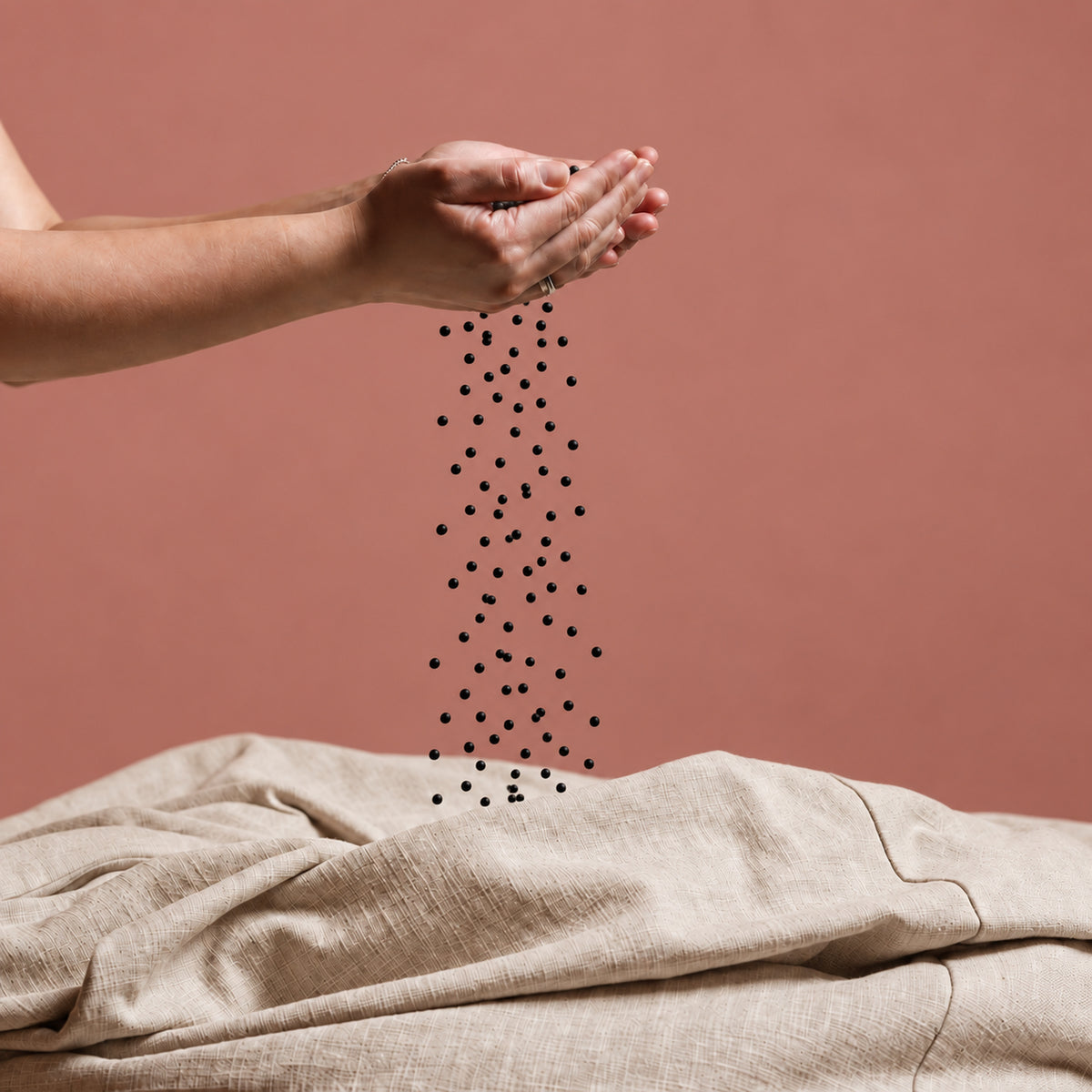 Fill Co Black beans poured from cupped hands into an oatmeal cover