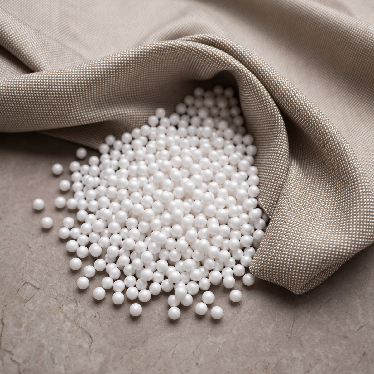 Fill Co White beans spilling from an oatmeal cloth onto stone