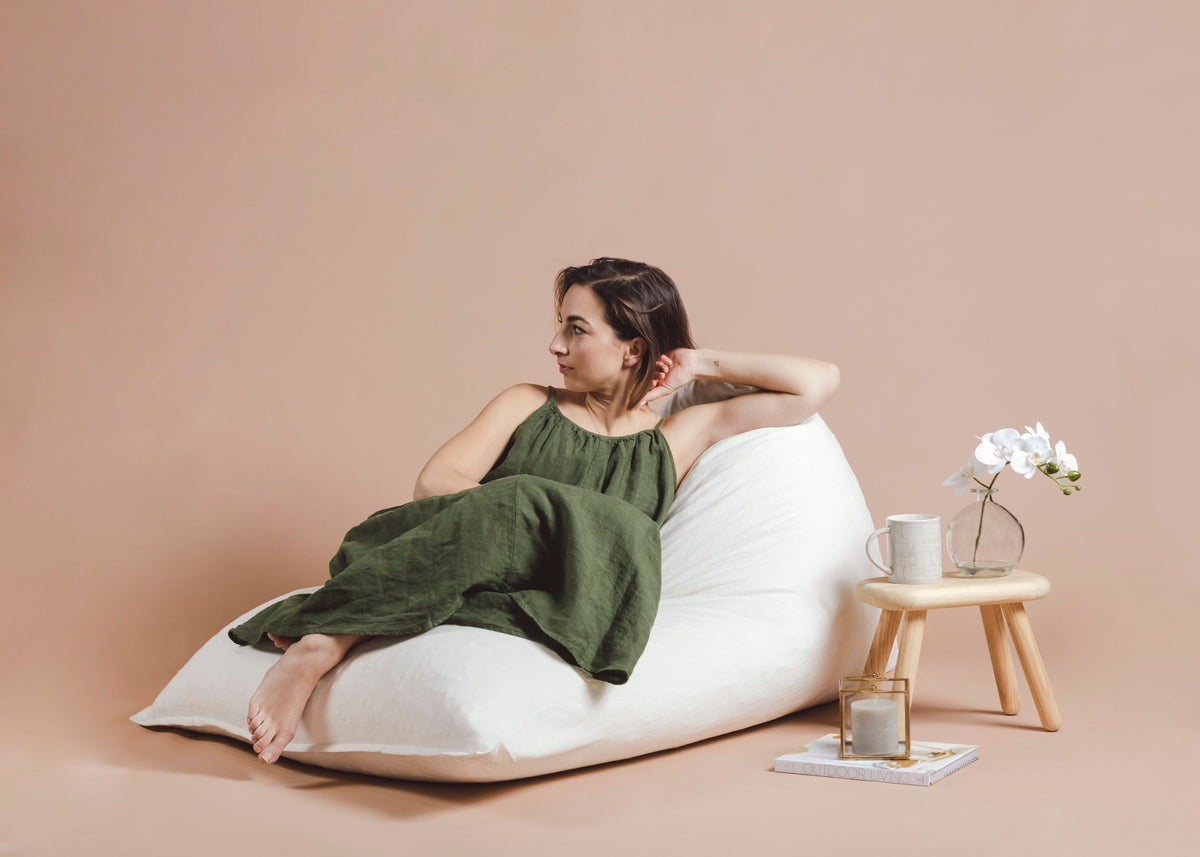 Grey outdoor bean bags on a lawn